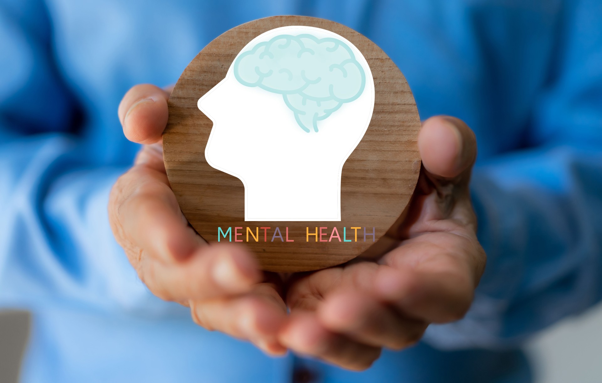 Mental health awareness, human hand care and support hold white paper head and glowing brain with physical and mental health, wellbeing, brain health, psychological support, healthcare and mindfulness