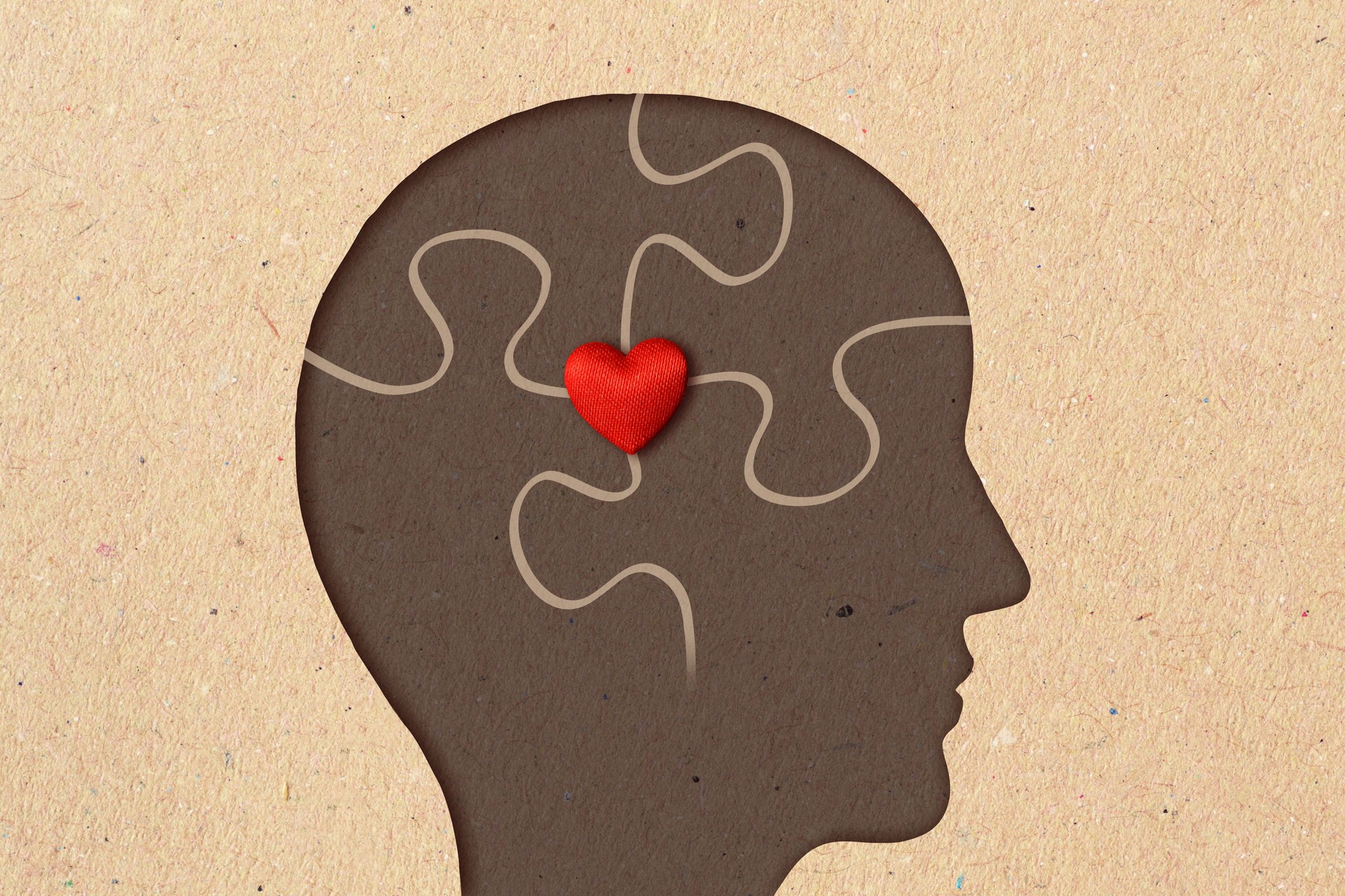 Profile silhouette of man with puzzle pieces and heart - Concept of psychology, love and mental health